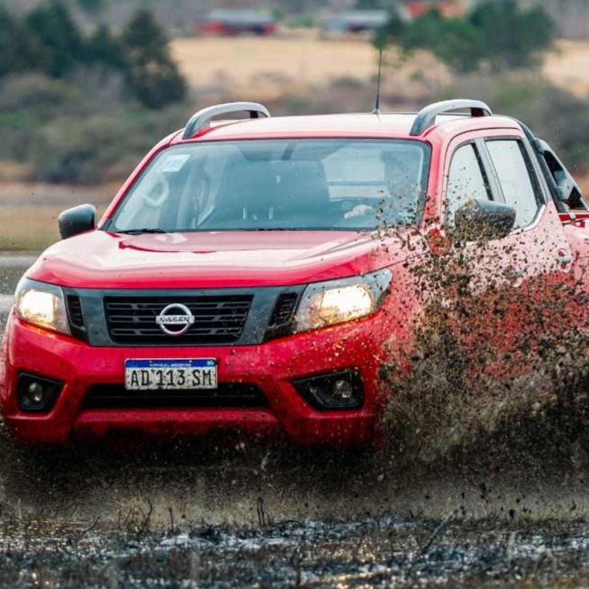 Off-road truck driving through mud